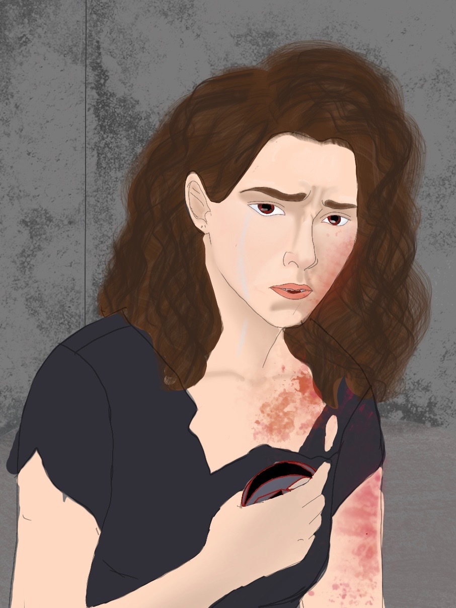 Lori holding Ray's emblem